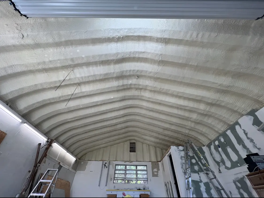 Spray polyurethane foam applied to the underside of a metal roof deck in St. Stephens